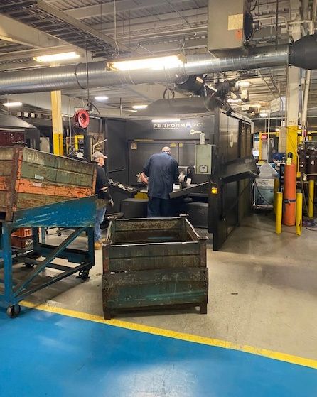 An employee on the shop floor of North American Stamping Group's Muncie factory.