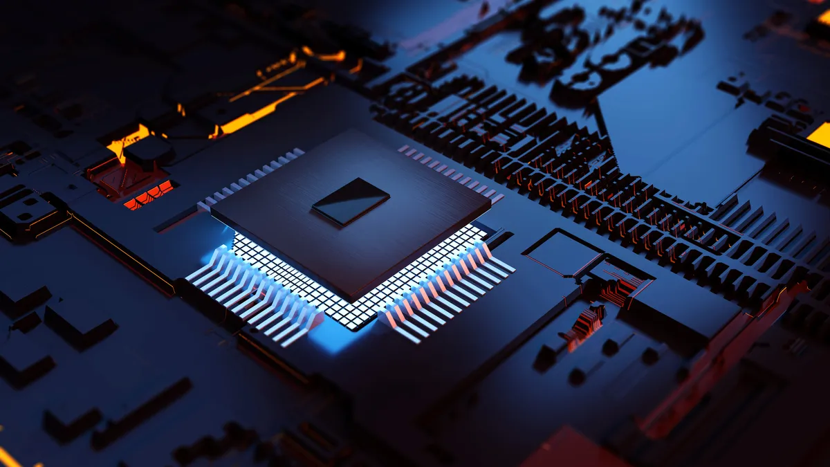 A CPU sits on a circuit board with a glowing chipset.