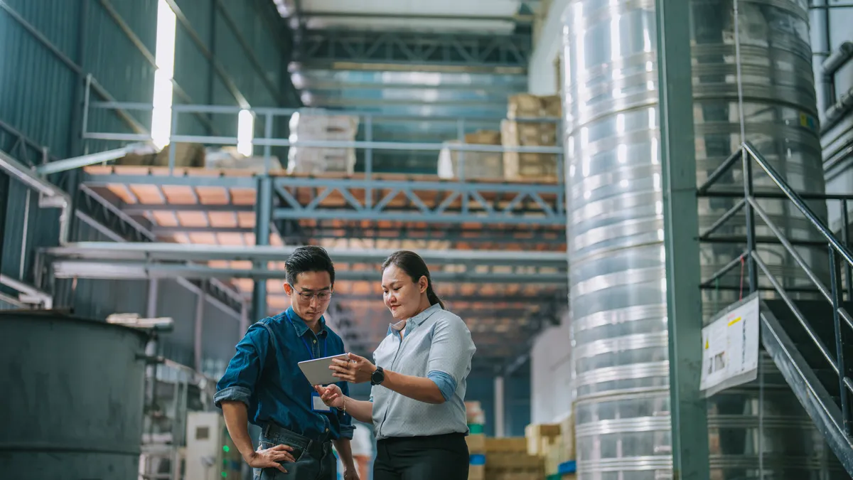 Female manager talking to warehouse person